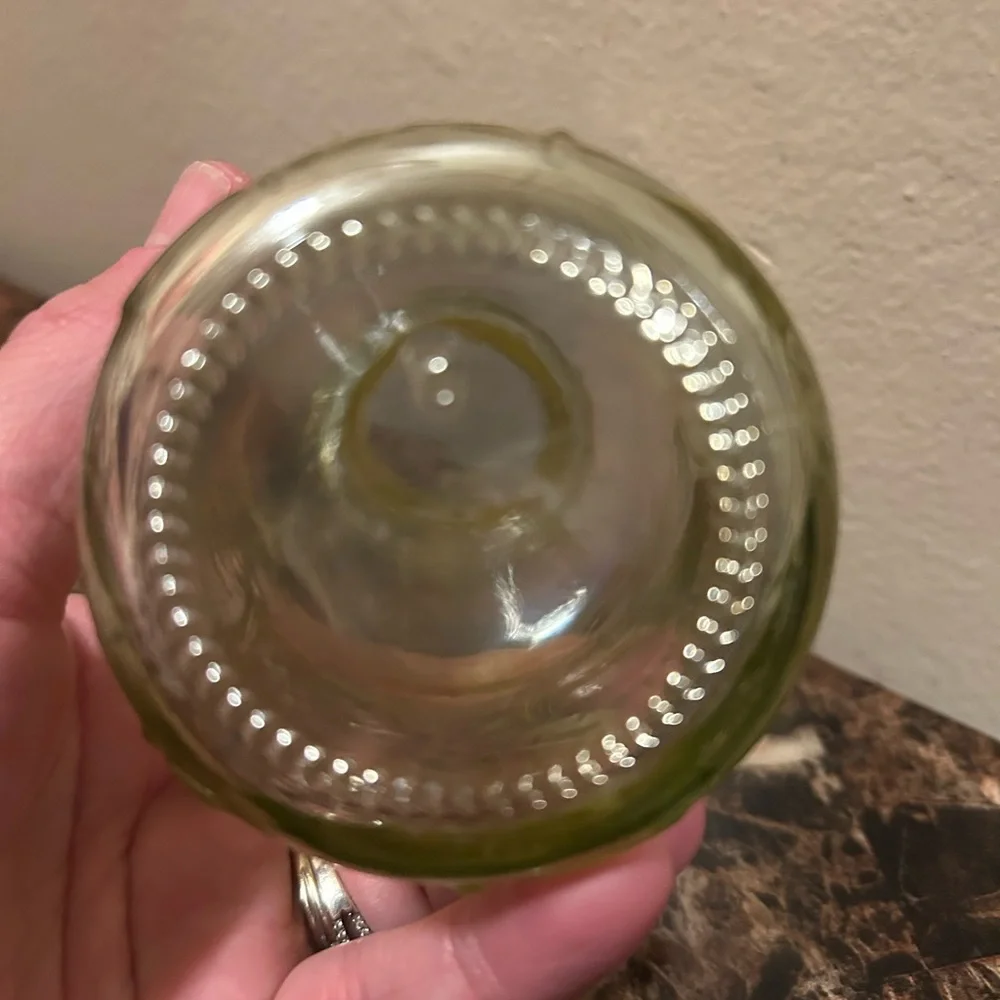 yellow iridescent glass vase with a leaf etching